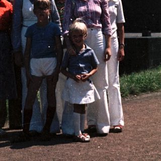 Family group photo near industrial monument.