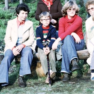 Family group photo in forested area, 1970s style.