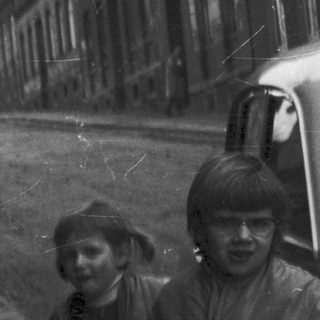 Narrow alleyway with two children walking.
