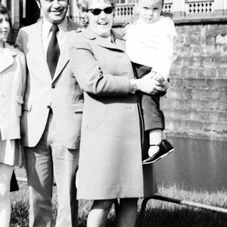Family portrait in front of historic palace.