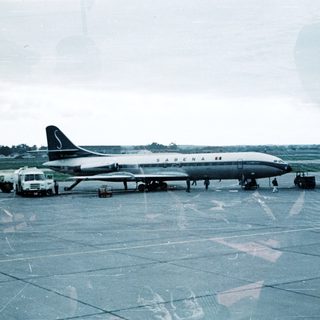 Vintage jetliner "SABENA" on airport tarmac.