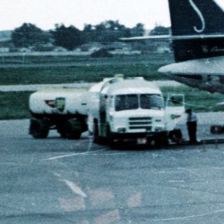 Vintage jetliner "SABENA" on airport tarmac.