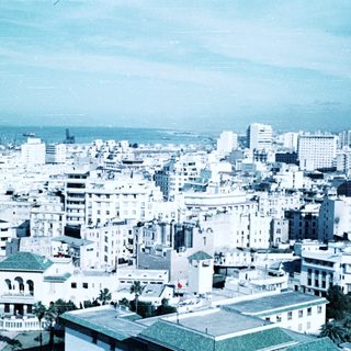 Urban cityscape with dense mid-20th-century architecture.