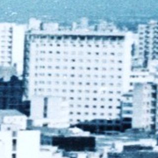 Urban cityscape with dense mid-20th-century architecture.
