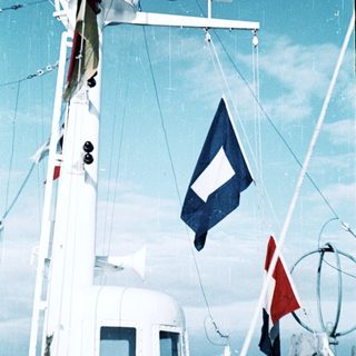 Maritime vessel displaying Danish maritime signal flags.
