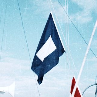 Maritime vessel displaying Danish maritime signal flags.