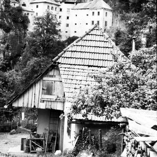 Historic castle perched on rocky cliffside.