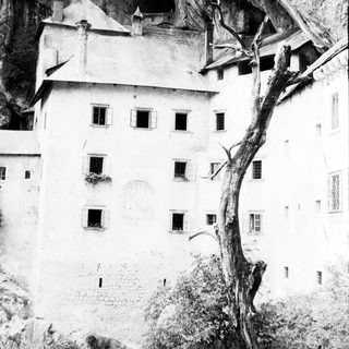 Predjama Castle perched in a cliffside cave.