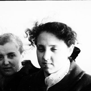 Two individuals outdoors, possibly in a candid moment.