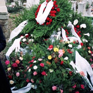 Elaborate funeral wreath on a grave.