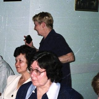 Group of people gathered for a formal dinner party.