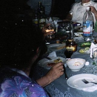 Group gathered indoors for a social dinner.