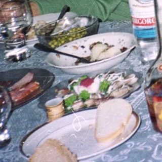 Family gathering at a celebratory dinner table.