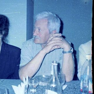 Two people seated at a dining table.