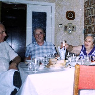 Family gathering at a formal dining table.