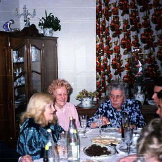 Family gathering at a festive dinner table.