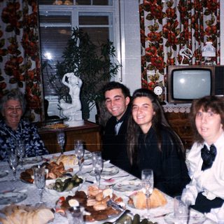 Family gathering at a festive dinner table.