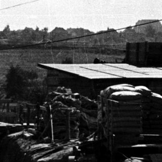 Construction site with concrete walls and scaffolding.