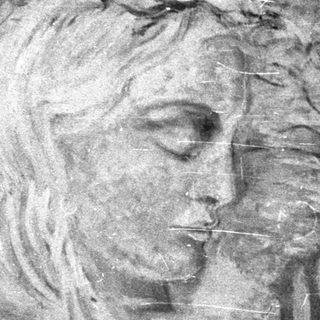 Framed portrait of a woman with hand near face.