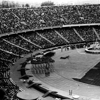 Large stadium filled with spectators; ceremony or event taking place.