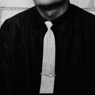Black and white portrait of a man in a suit.