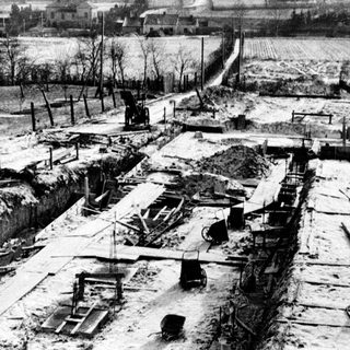 Devastated village area after wartime destruction.