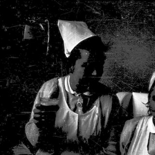 Two individuals in vintage pirate costumes.