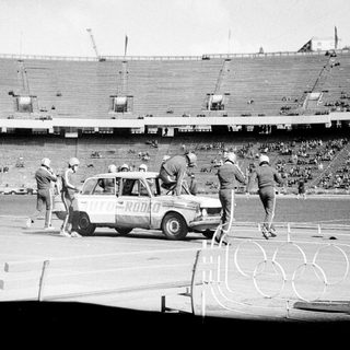 Automobile race preparation at 1968 Mexico City Olympics.