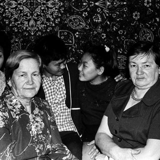 Group of people posing indoors, likely during an event.