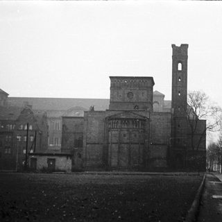 Historic church ruins with tall bell tower.