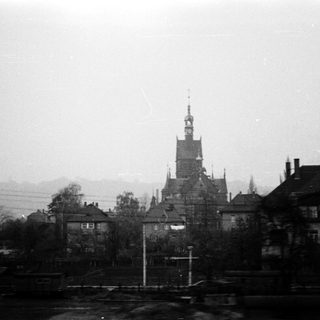 Historic town with prominent church tower.
