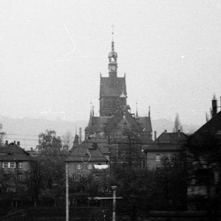 Historic town with prominent church tower.