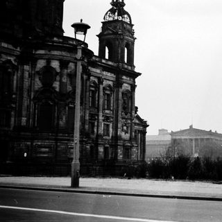 Historic building with clock tower, likely European.
