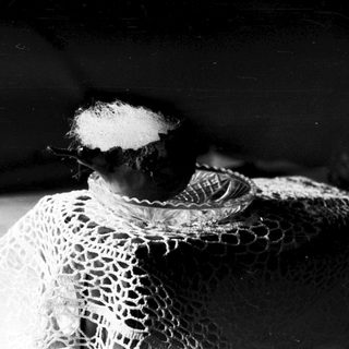 Vintage lace fabric with powdered substance.