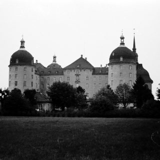 Baroque-style castle with domed towers.