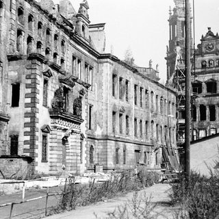 War-damaged European city buildings post-conflict.