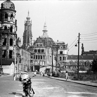 War-damaged European city with historic architecture.