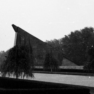 Memorial with triangular concrete structures and pathways.