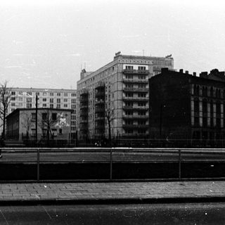 Urban residential buildings along a bridge.