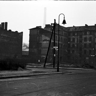 Abandoned industrial buildings in urban setting.