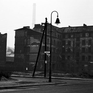 Abandoned industrial buildings in urban setting.