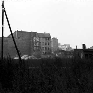 Damaged brick building in urban area.