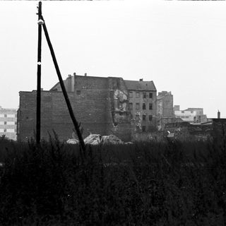 Damaged brick building in urban area.