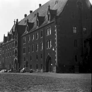 Historic stone building with Gothic architectural features.