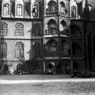 Historic Gothic-style building facade with arched windows.