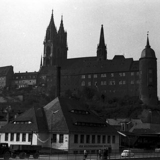 Historic cathedral and castle complex on hill.