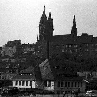 Historic cathedral and castle complex on hill.