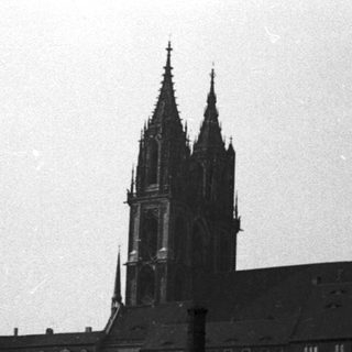 Historic cathedral and castle complex on hill.