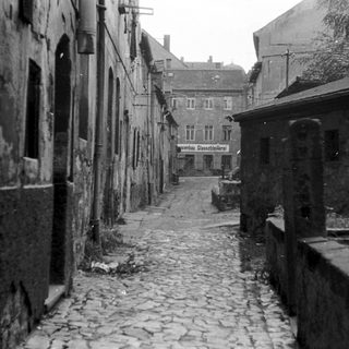 Narrow cobblestone street in old European town.
