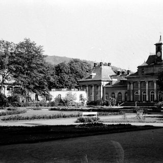 Elegant classical mansion with formal gardens.